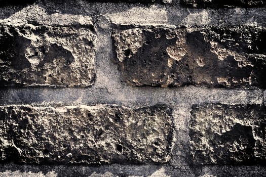 Aged and weathered old brick wall texture in a vintage retro design 