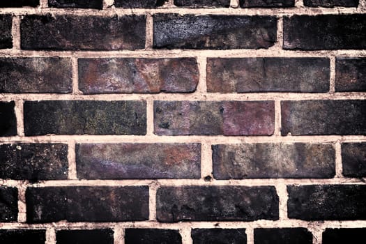 Aged and weathered old brick wall texture in a vintage retro design 