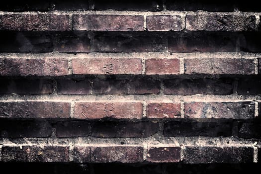 Aged and weathered old brick wall texture in a vintage retro design 