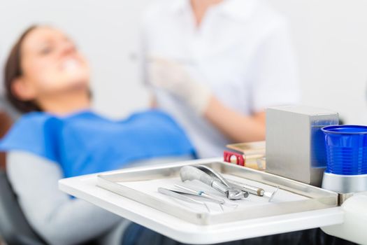 Sterile tools or medical instruments for a dentist, mirrors, tweezers, and syringe for local anesthetic in a dental practice