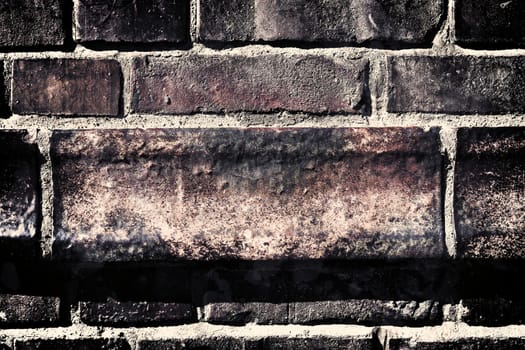 Aged and weathered old brick wall texture in a vintage retro design 