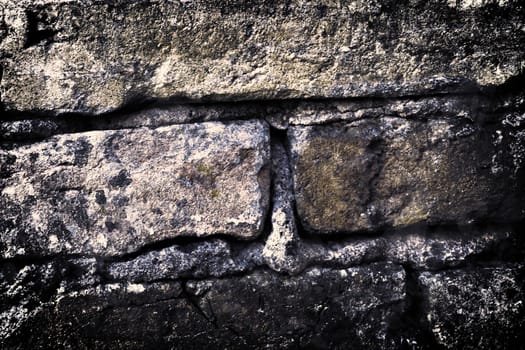 Aged and weathered old brick wall texture in a vintage retro design 