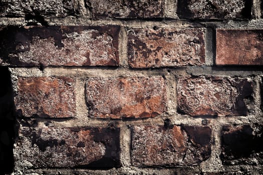 Aged and weathered old brick wall texture in a vintage retro design 