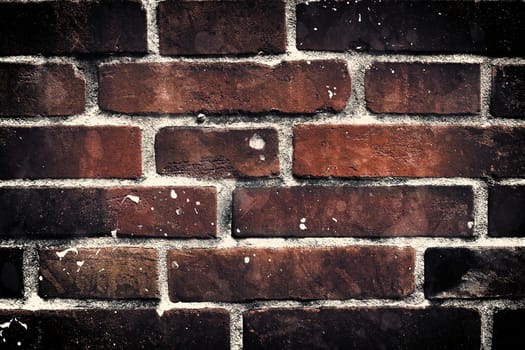 Aged and weathered old brick wall texture in a vintage retro design 