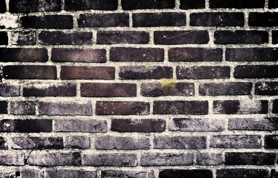 Aged and weathered old brick wall texture in a vintage retro design 