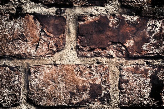 Aged and weathered old brick wall texture in a vintage retro design 