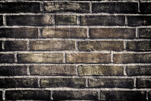 Aged and weathered old brick wall texture in a vintage retro design 