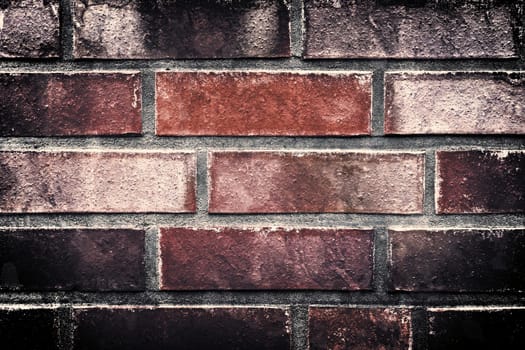 Aged and weathered old brick wall texture in a vintage retro design 