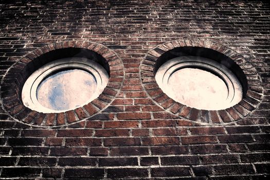 Aged and weathered old brick wall texture in a vintage retro design 