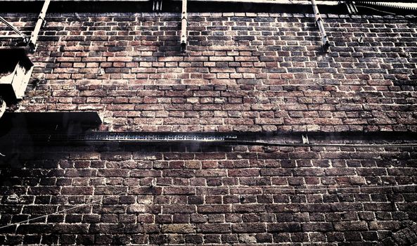 Aged and weathered old brick wall texture in a vintage retro design 