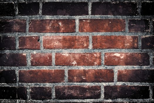 Aged and weathered old brick wall texture in a vintage retro design 