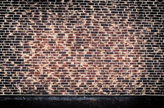 Aged and weathered old brick wall texture in a vintage retro design 