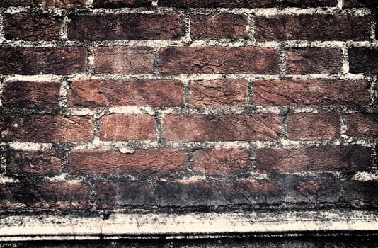 Aged and weathered old brick wall texture in a vintage retro design 