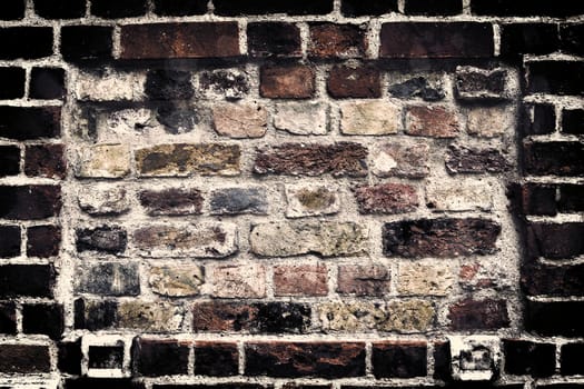 Aged and weathered old brick wall texture in a vintage retro design 