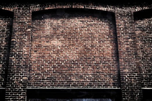 Aged and weathered old brick wall texture in a vintage retro design 