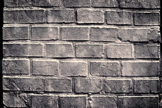 Aged and weathered old brick wall texture in a vintage retro design 