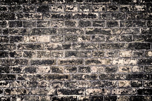 Aged and weathered old brick wall texture in a vintage retro design 