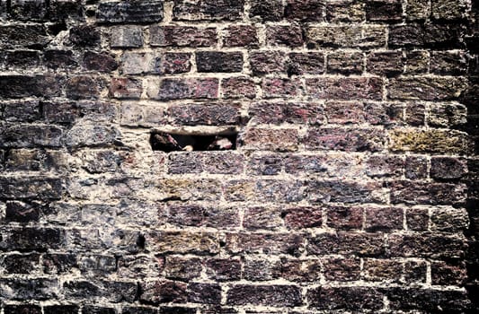 Aged and weathered old brick wall texture in a vintage retro design 