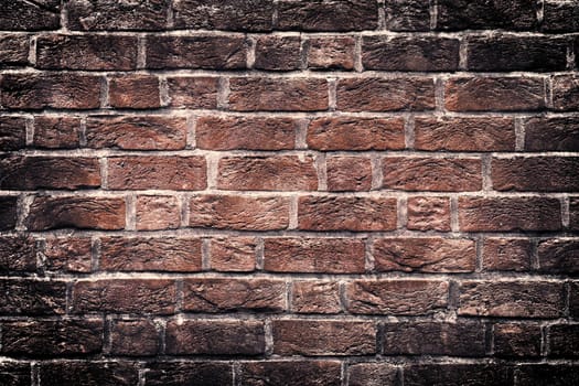 Aged and weathered old brick wall texture in a vintage retro design 