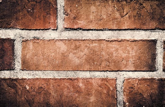 Aged and weathered old brick wall texture in a vintage retro design 