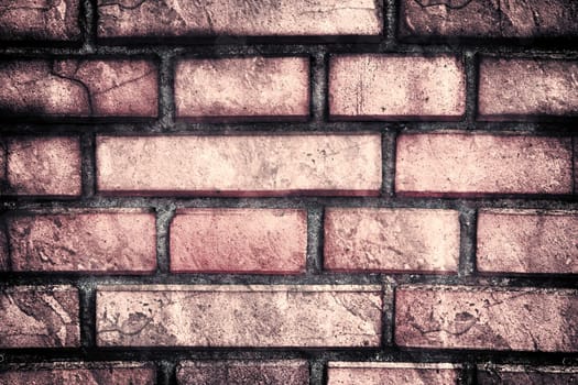 Aged and weathered old brick wall texture in a vintage retro design 