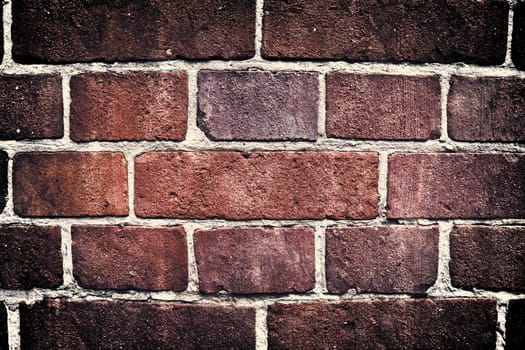 Aged and weathered old brick wall texture in a vintage retro design 