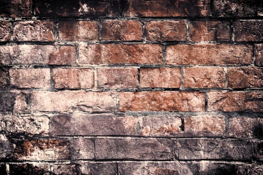 Aged and weathered old brick wall texture in a vintage retro design 