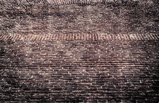 Aged and weathered old brick wall texture in a vintage retro design 