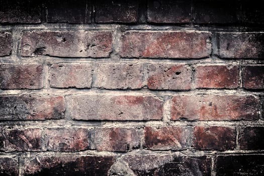 Aged and weathered old brick wall texture in a vintage retro design 