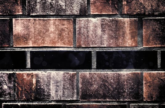 Aged and weathered old brick wall texture in a vintage retro design 