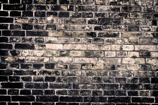 Aged and weathered old brick wall texture in a vintage retro design 