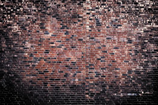 Aged and weathered old brick wall texture in a vintage retro design 