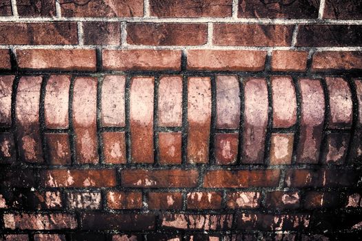 Aged and weathered old brick wall texture in a vintage retro design 