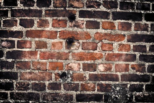 Aged and weathered old brick wall texture in a vintage retro design 