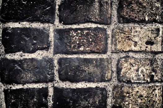 Aged and weathered old brick wall texture in a vintage retro design 