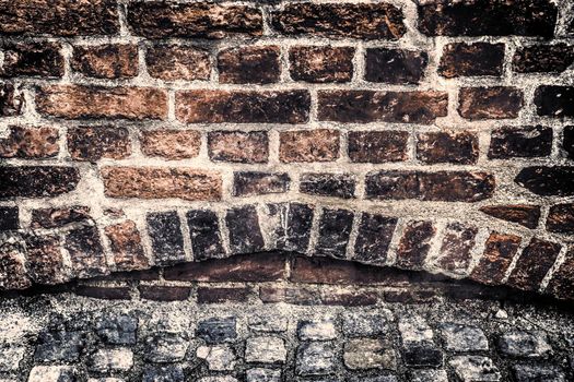 Aged and weathered old brick wall texture in a vintage retro design 