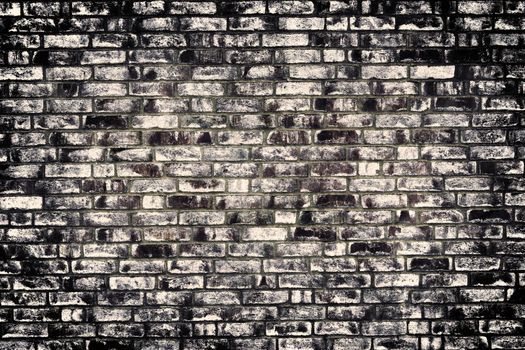 Aged and weathered old brick wall texture in a vintage retro design 