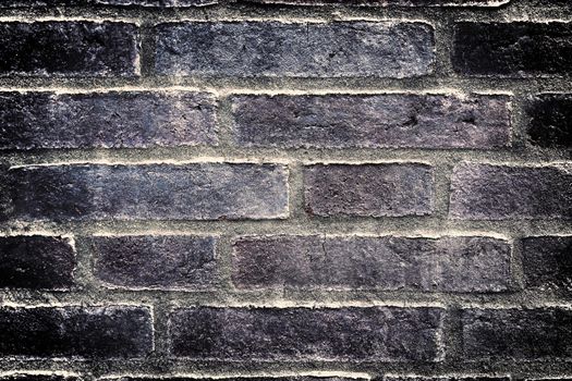 Aged and weathered old brick wall texture in a vintage retro design 