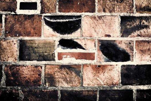 Aged and weathered old brick wall texture in a vintage retro design 