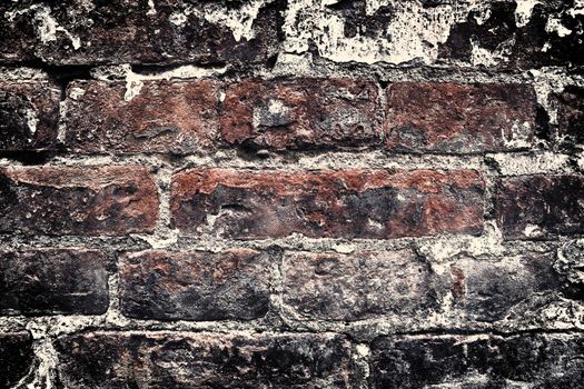 Aged and weathered old brick wall texture in a vintage retro design 