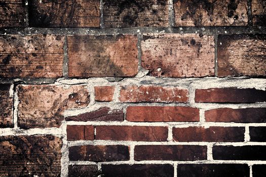 Aged and weathered old brick wall texture in a vintage retro design 