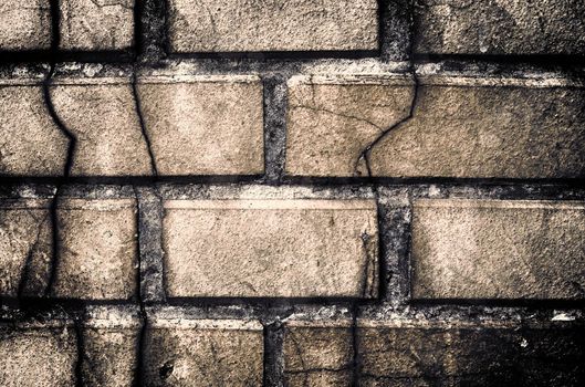 Aged and weathered old brick wall texture in a vintage retro design 