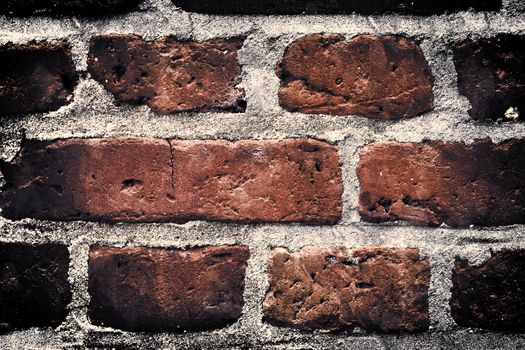 Aged and weathered old brick wall texture in a vintage retro design 