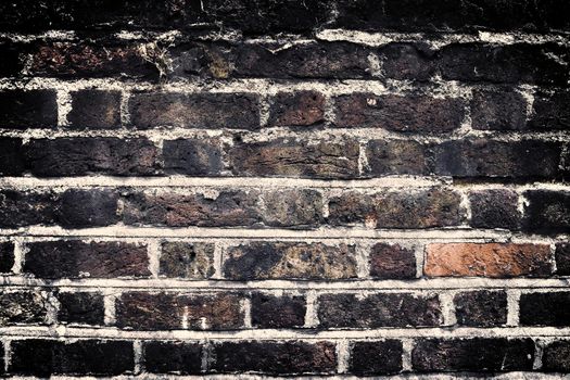 Aged and weathered old brick wall texture in a vintage retro design 