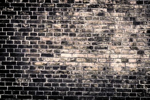 Aged and weathered old brick wall texture in a vintage retro design 