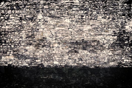 Aged and weathered old brick wall texture in a vintage retro design 