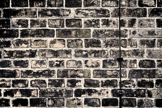 Aged and weathered old brick wall texture in a vintage retro design 