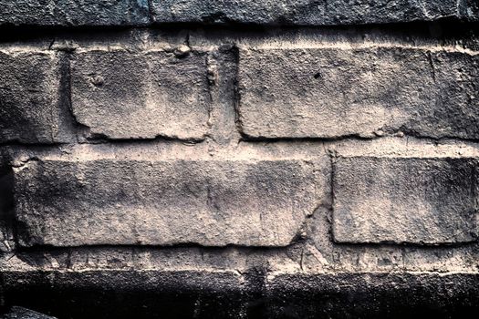 Aged and weathered old brick wall texture in a vintage retro design 