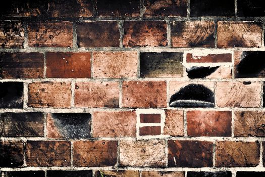 Aged and weathered old brick wall texture in a vintage retro design 