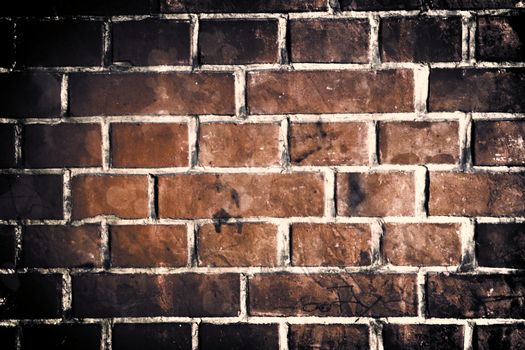 Aged and weathered old brick wall texture in a vintage retro design 